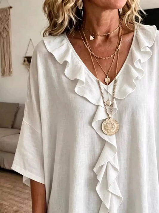 Plus-size white ruffle V-neck blouse with 3/4 sleeves, flowy fabric