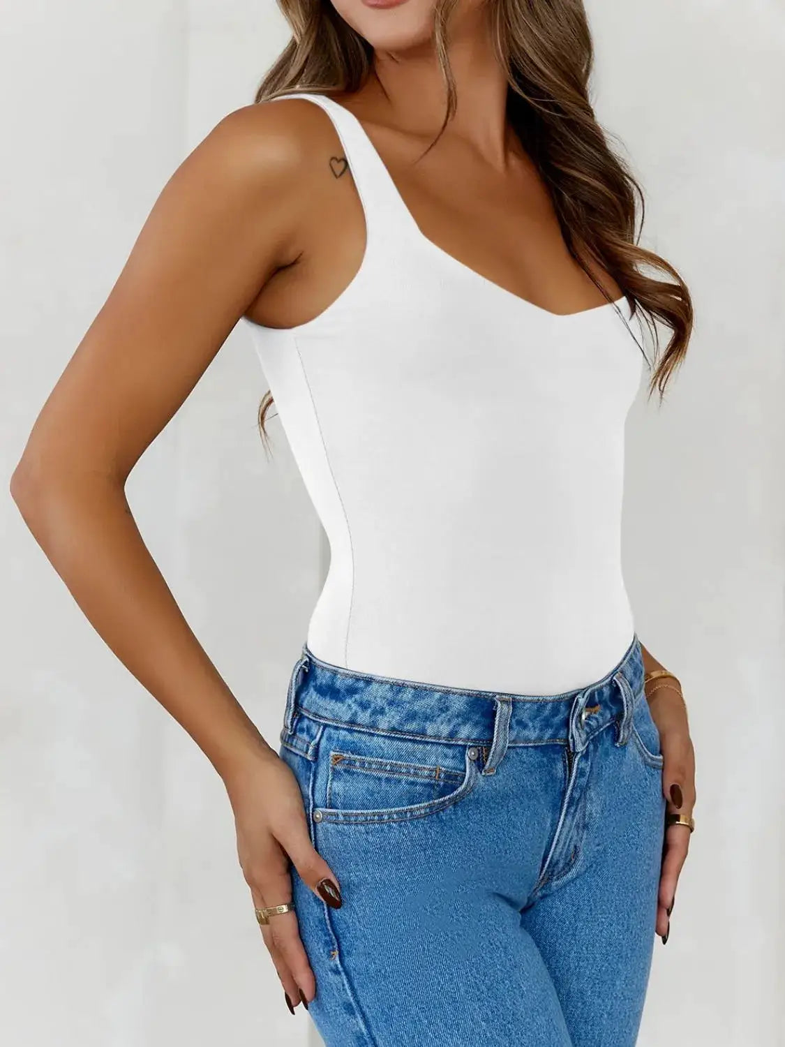 Trendsi solid white wide-strap cami worn with blue jeans