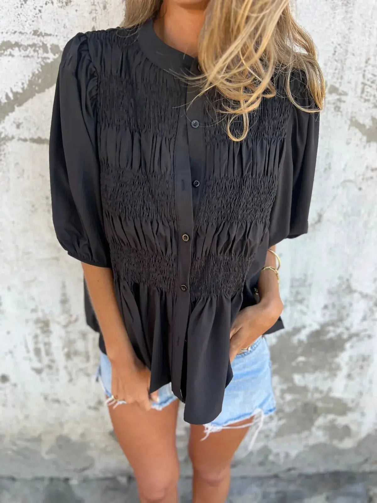 Full-size smocked puff-sleeve blouse in black with button-front placket; plus size.