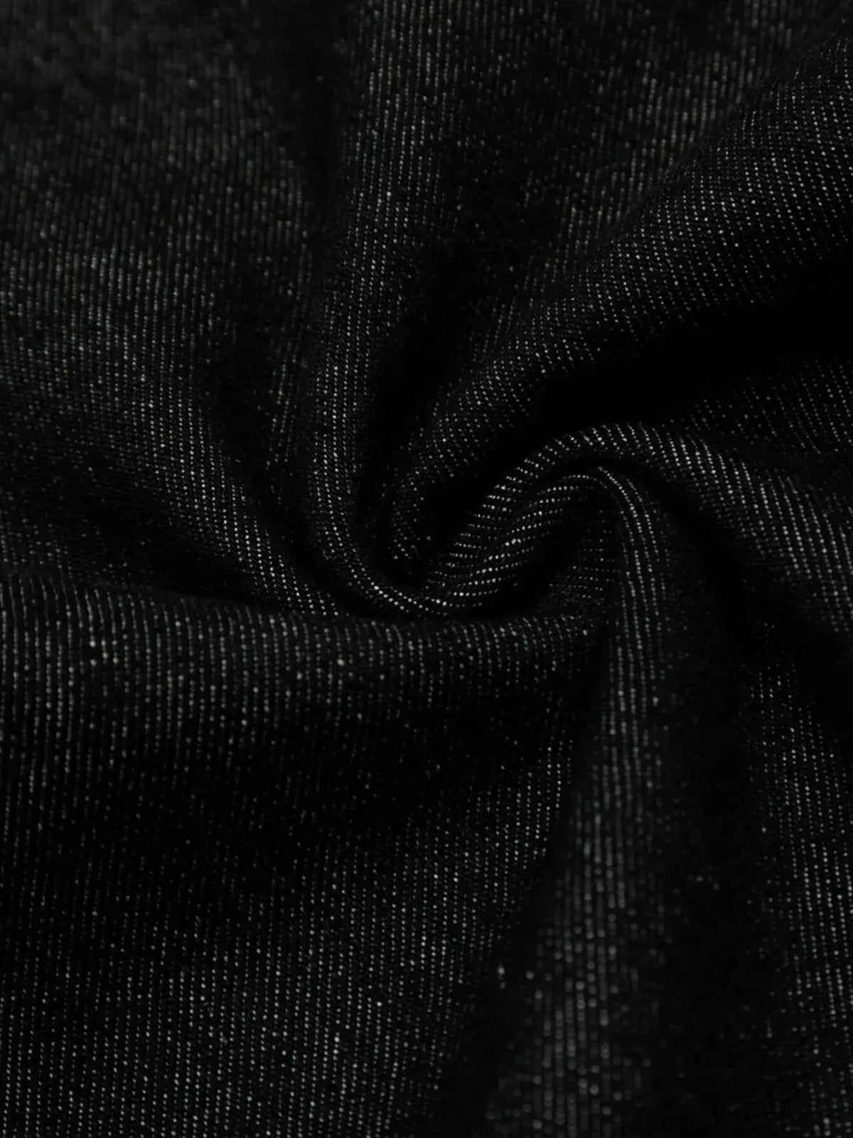 Men's denim shorts fabric close-up in dark wash with woven texture