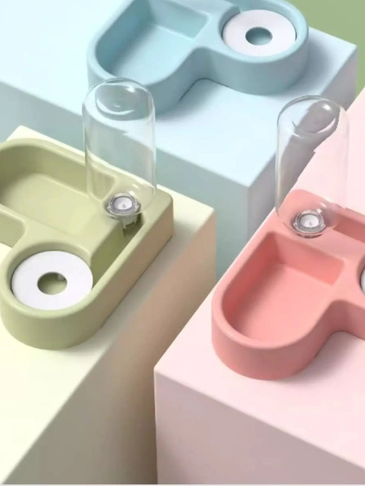 Set of three pastel automatic water-refilling pet bowls with built-in reservoirs