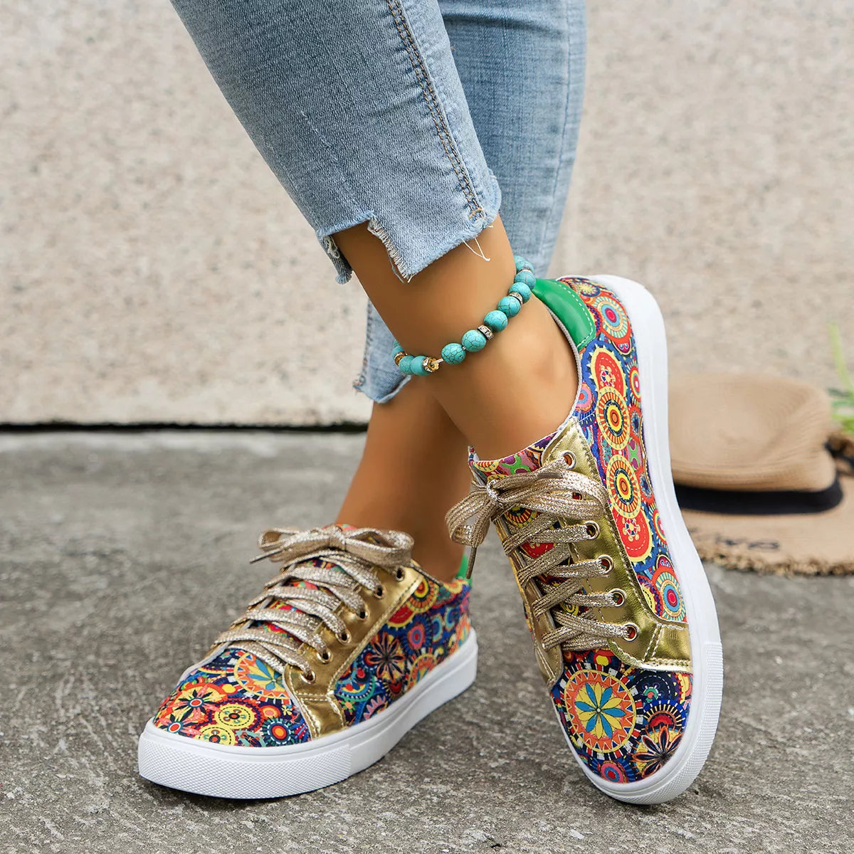 Printed round-toe sneakers with a colorful mandala-inspired print, gold metallic accents, white sole, lace-up