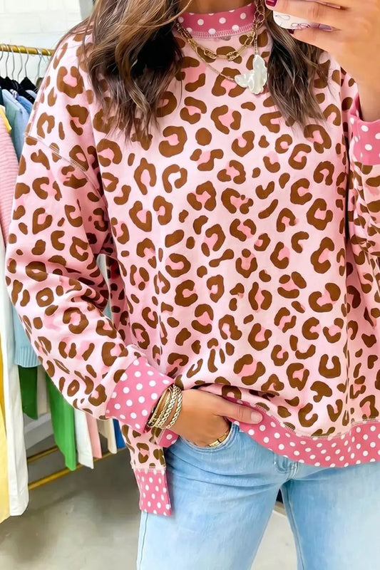 Polka dot contrast trim leopard round-neck sweatshirt in pink with pink polka-dot cuffs and hem