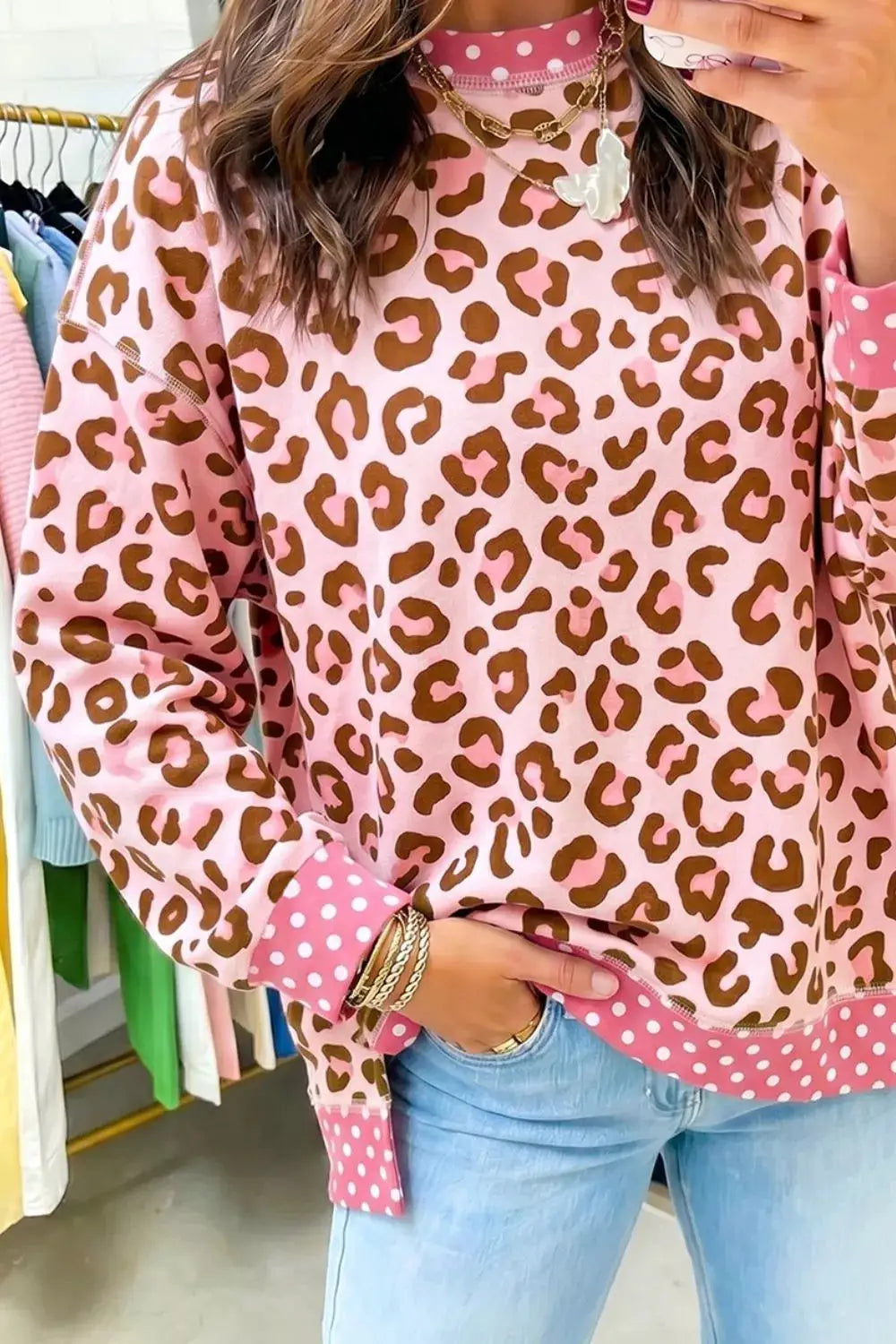 Polka dot contrast trim leopard round-neck sweatshirt in pink with pink polka-dot cuffs and hem