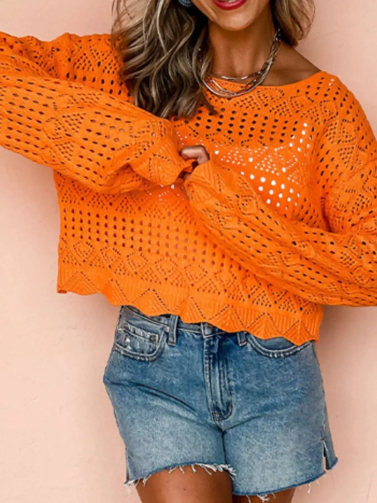 Openwork crochet boat-neck knit cover-up in orange by Trendsi, shown with denim shorts.