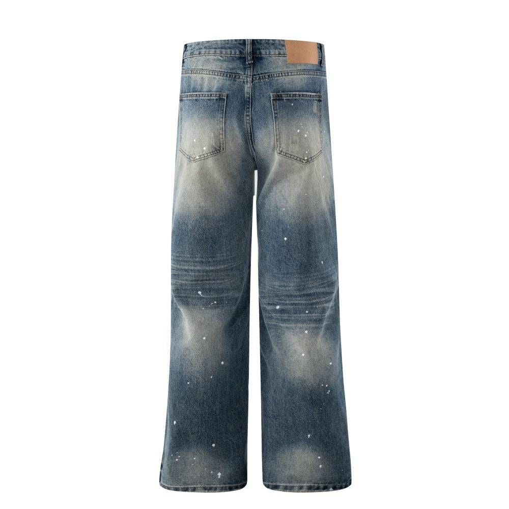Whitewashed denim wide-leg jeans by eprolo, back view with faded patches and leather patch