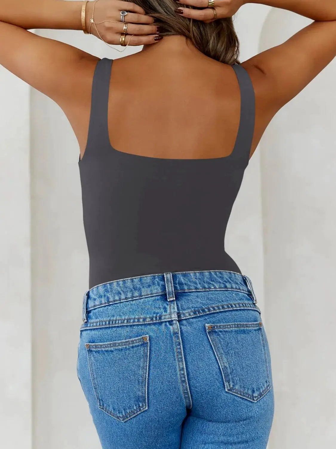 Solid Color Wide Strap Cami by Trendsi in charcoal gray, back view with blue jeans.