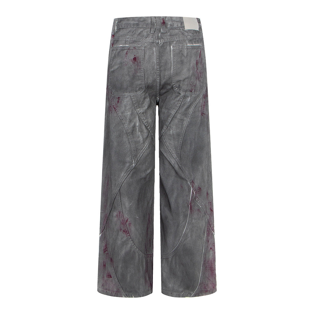 Distressed dyed denim jeans by eprolo, gray wide-leg back view with purple paint splatters.