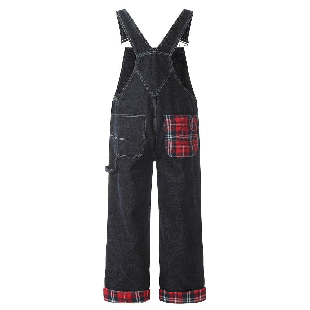 Color-blocked denim overalls with red plaid patch pocket and rolled plaid cuffs