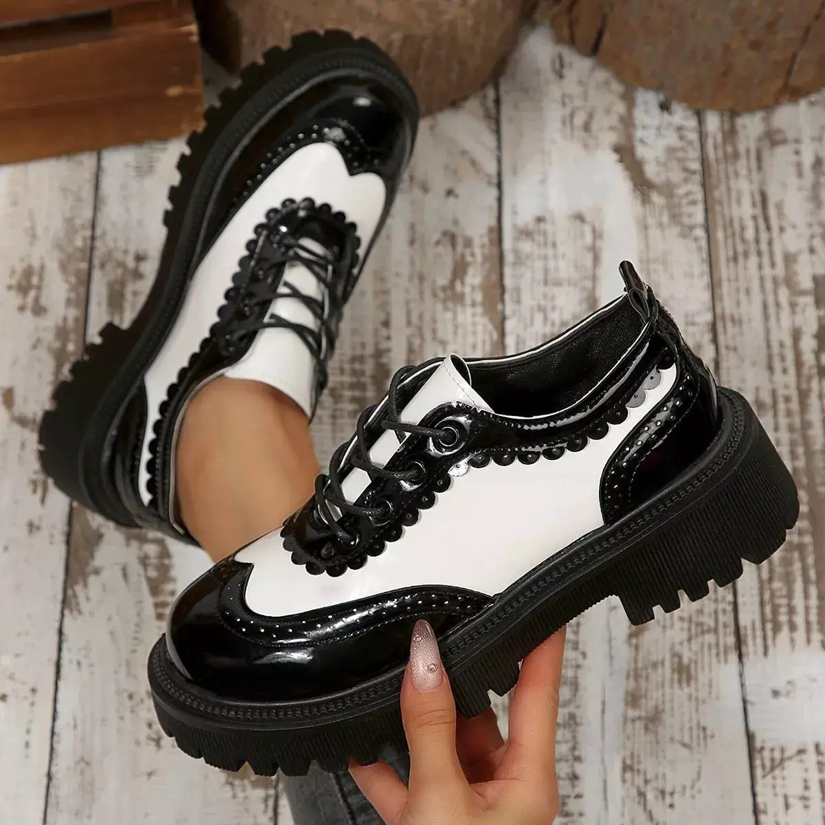 Round Toe Lace Up Sneakers in black and white patent leather with a chunky platform sole