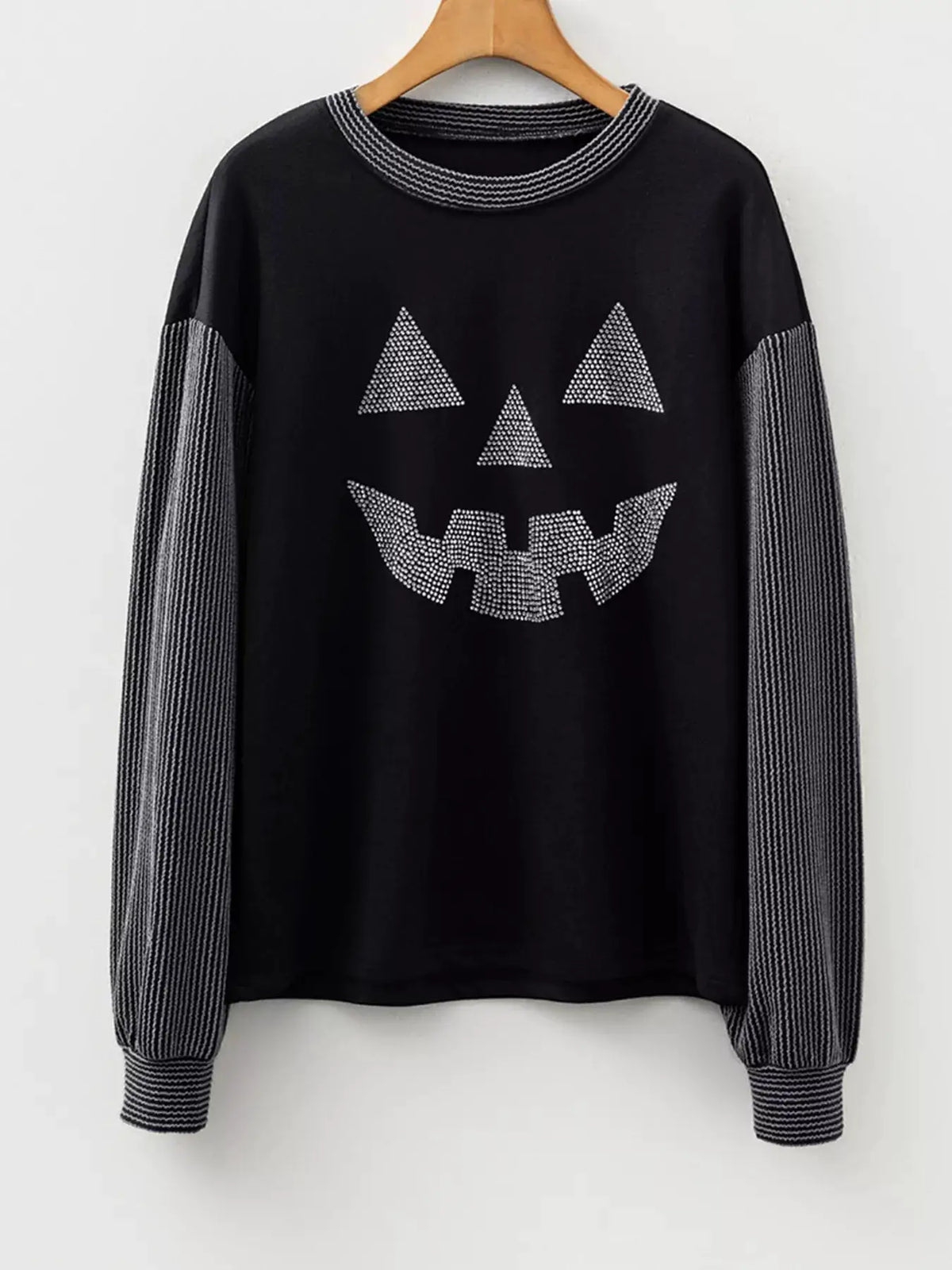 Black Halloween rhinestone pumpkin-face long sleeve top with contrast ribbed striped sleeves