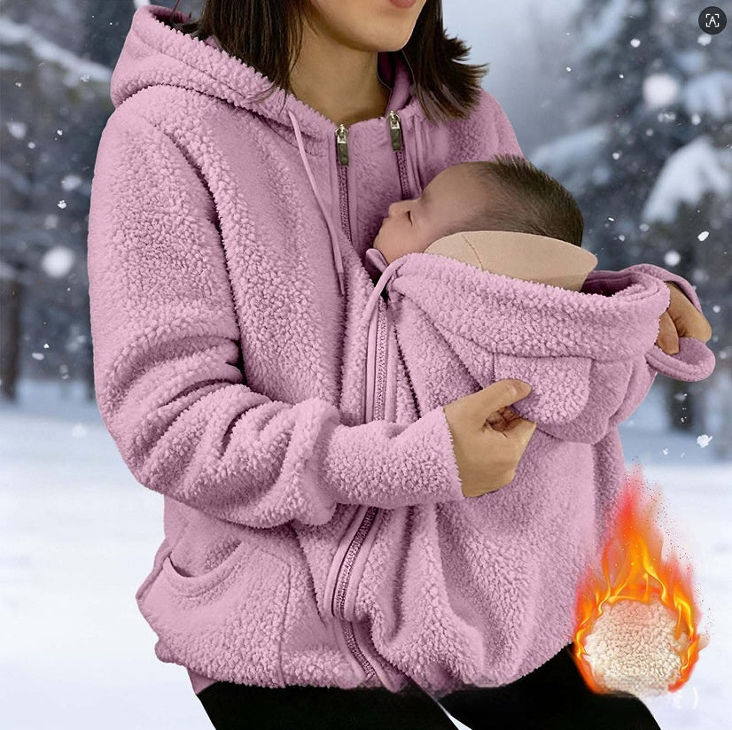 Corduroy Hooded Sweatshirt nursing hoodie in pink; mom cradling newborn while snow falls.