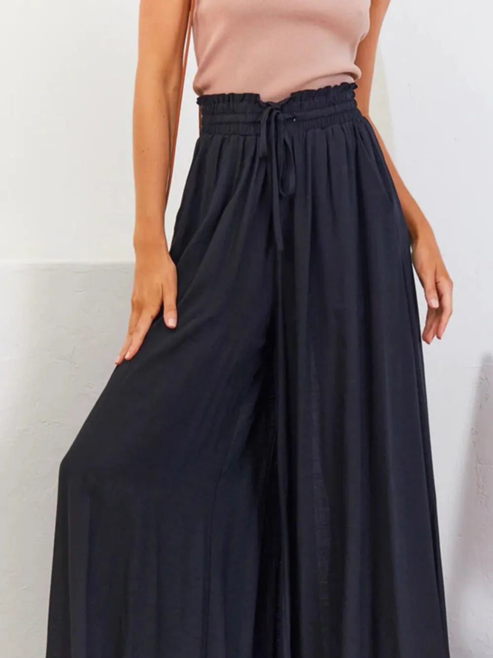 High waist wide-leg palazzo pants in black with pockets and drawstring waist