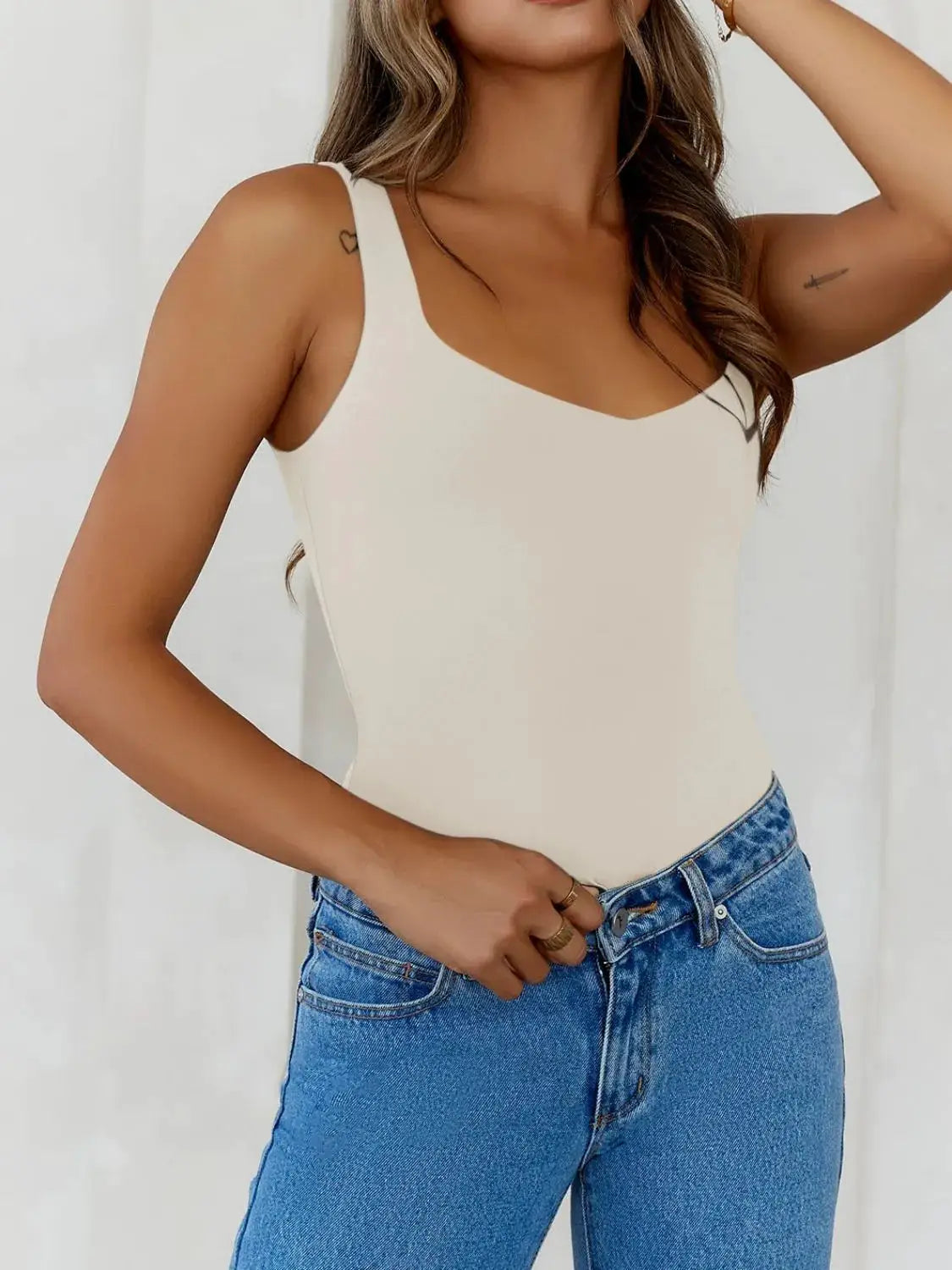 Solid Color Wide Strap Cami in beige, paired with blue jeans