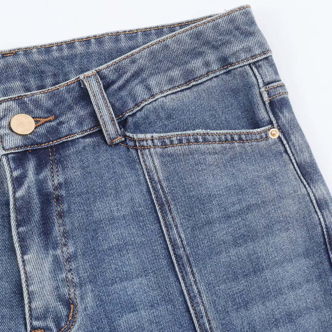 Mid waist flared jeans for women in blue denim with belt loops and copper rivets.