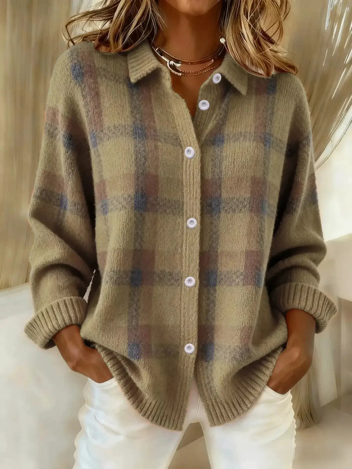 Stretchy plaid acrylic knit cardigan with button-front; beige with blue accents.