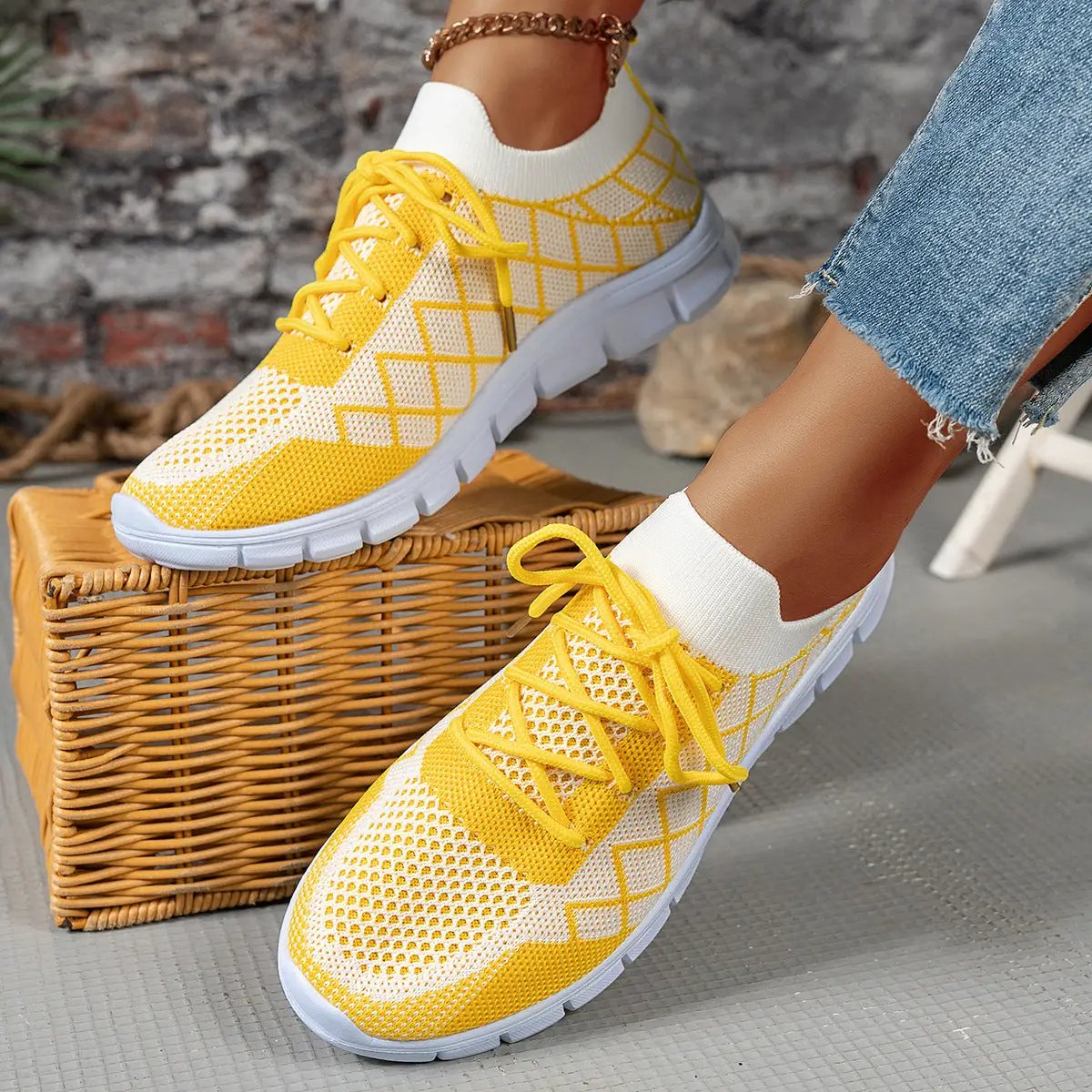 Colorblock plaid lace-up flyknit sneakers in yellow and white mesh for women, breathable casual walking shoes.