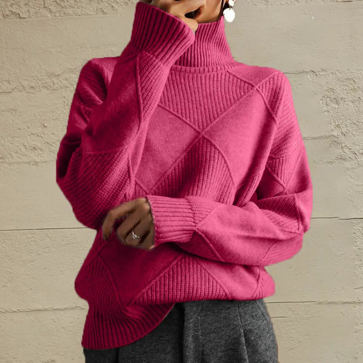 Geometric diamond-knit pink turtleneck long-sleeve sweater in stretch knit.