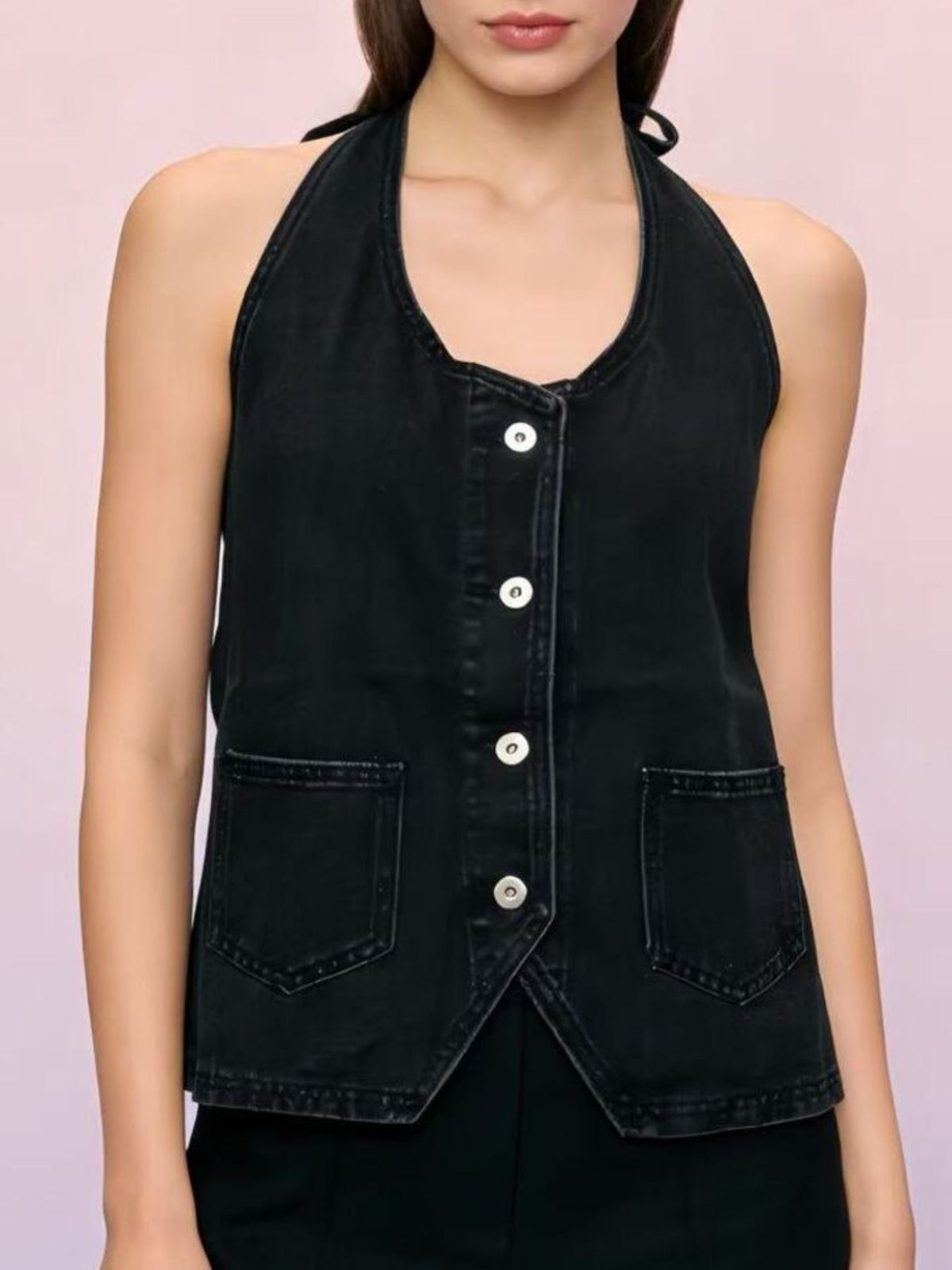 Halter-neck black denim vest with button-front closure, adjustable tie closure, and two front pockets