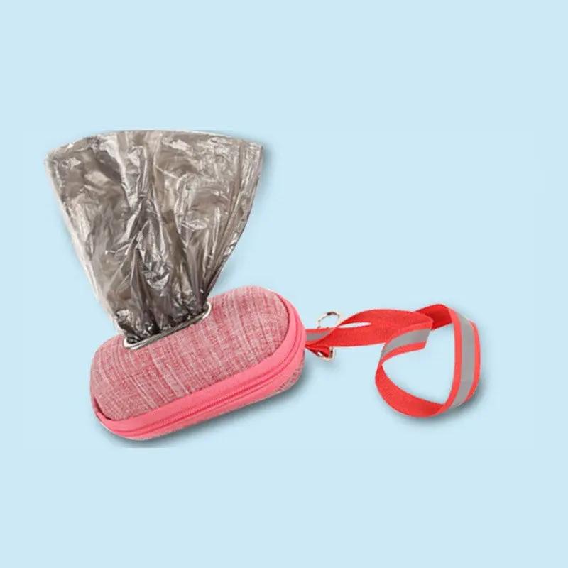 Portable dog poop bag dispenser by AdTec, pink fabric case with red strap