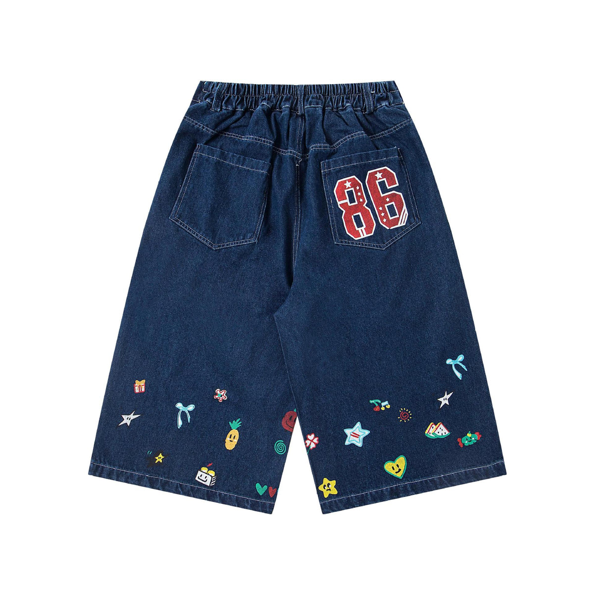 Printed loose jeans shorts in dark denim with colorful patch motifs and a red 86 patch on the back pocket