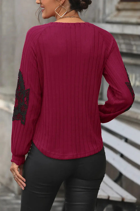 Womens ribbed burgundy knit sweater with black lace sleeve patches, back view