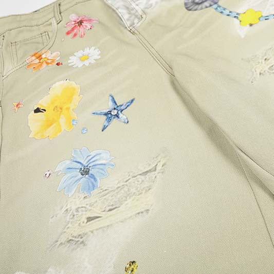 Denim shorts in apricot with 3D floral print and distressed patches