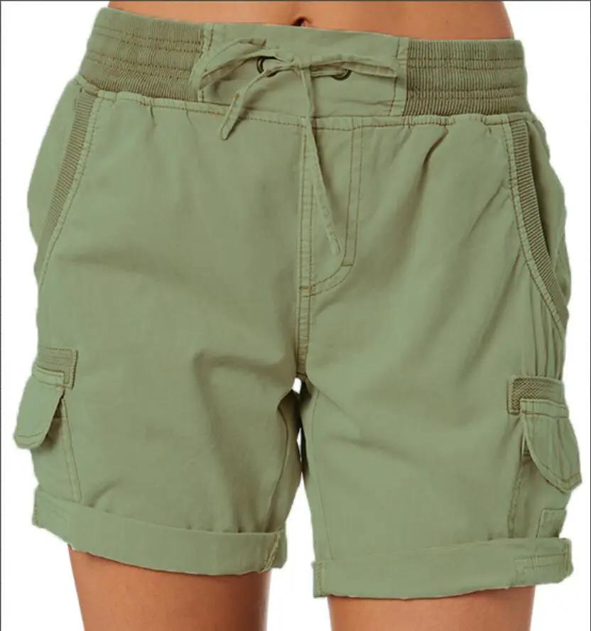 Lightweight women's cargo shorts with drawstring waist and deep pockets in olive green
