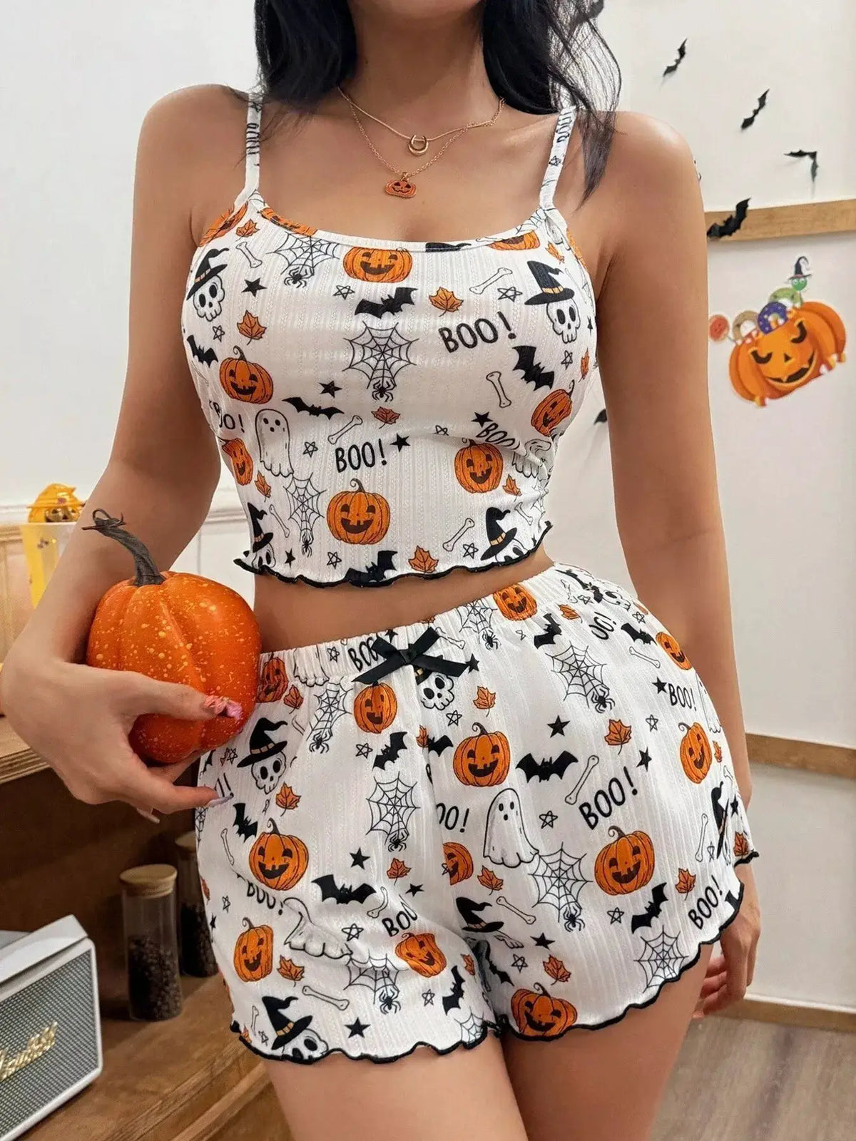 Halloween pumpkin-print cami and shorts lounge set by Trendsi, white with orange pumpkins and bats.