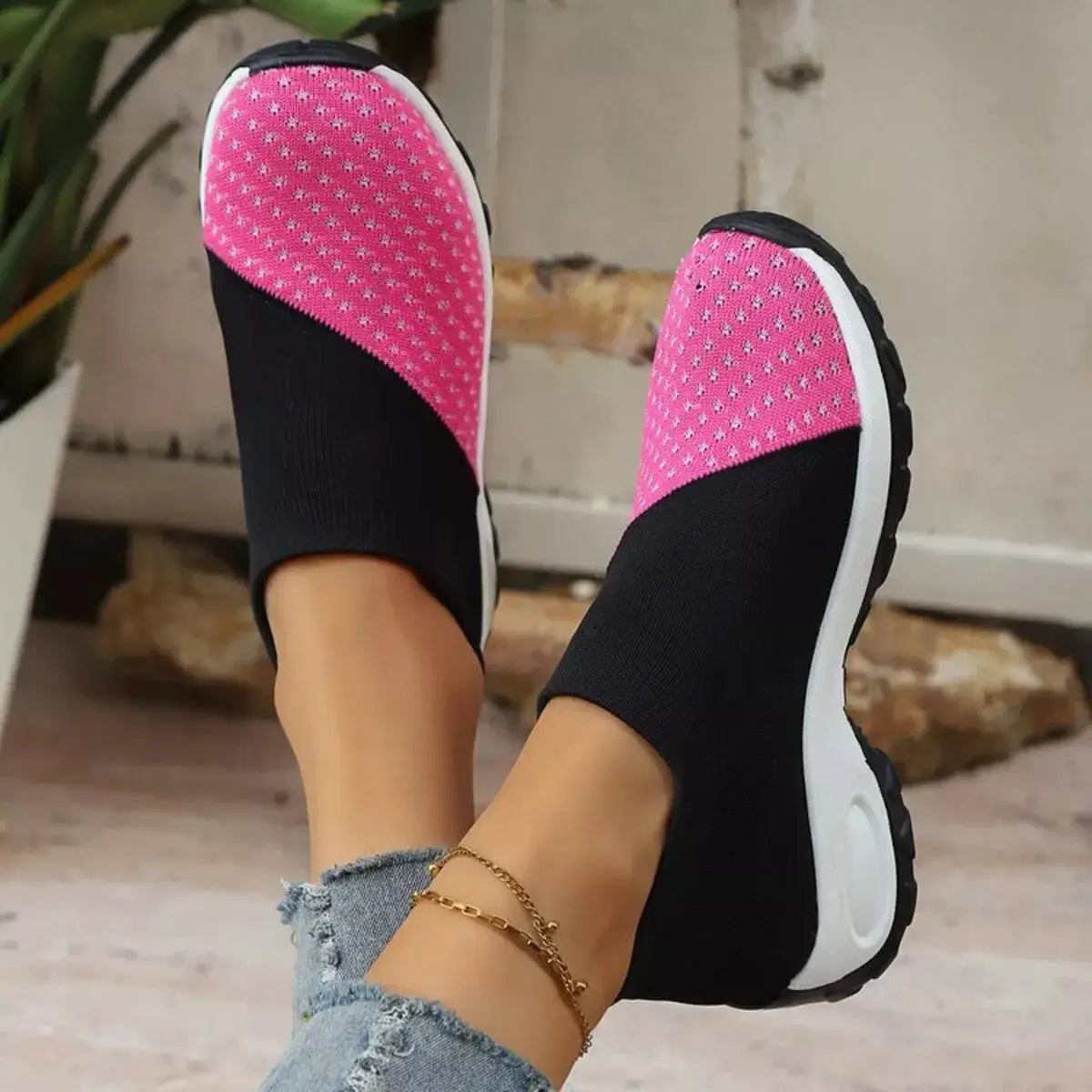 Pair of Color Block Mesh Athletic Shoes with pink uppers, black knit sides, and white soles