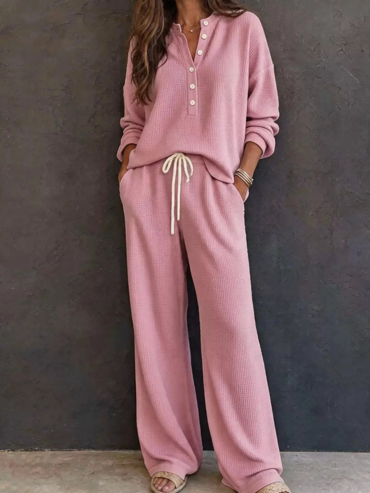 Waffle-knit Henley top and wide-leg pants set in pink, with drawstring waist.