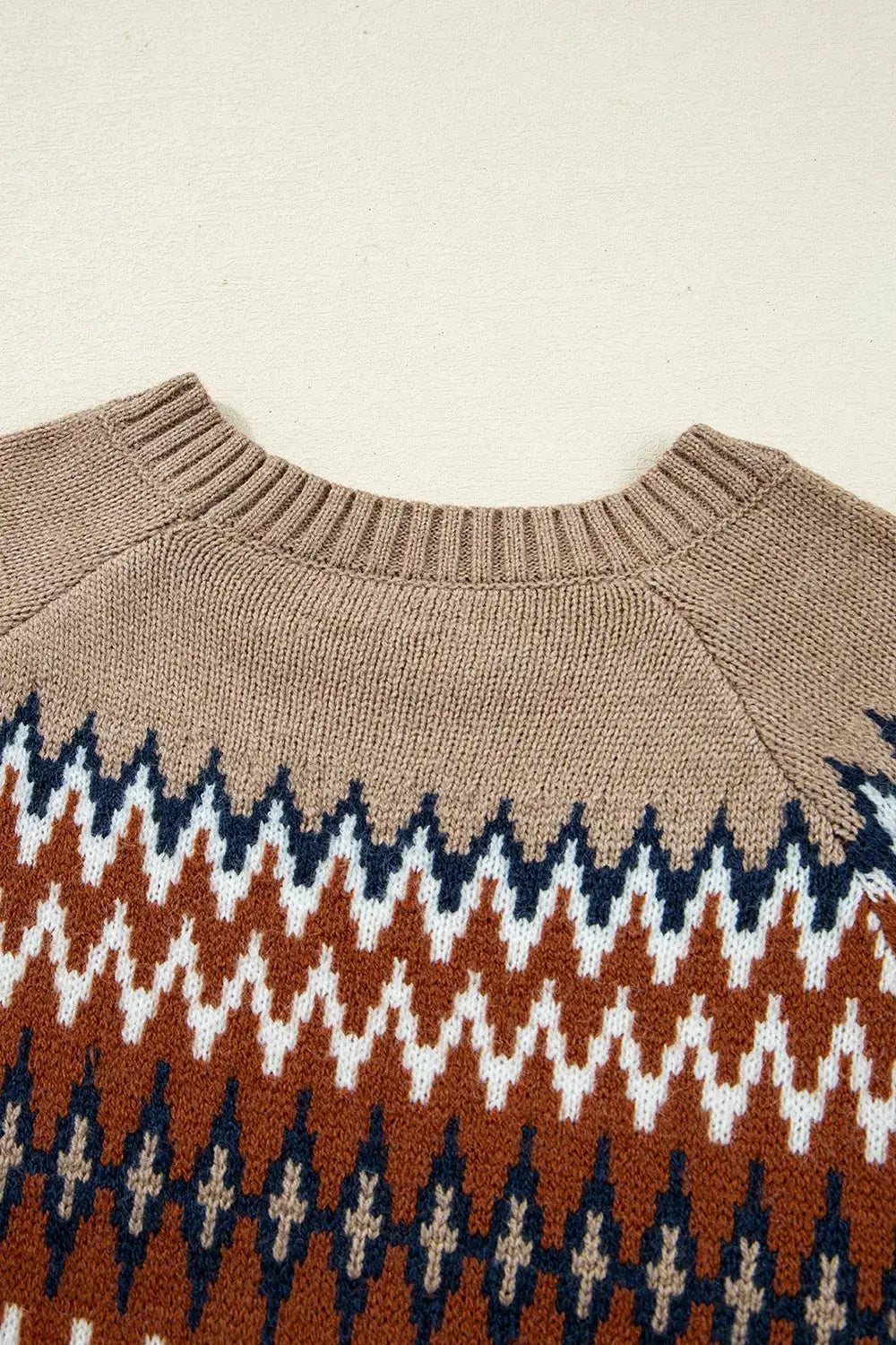 Geometric pattern long sleeve sweater in beige with rust, navy and white diamonds