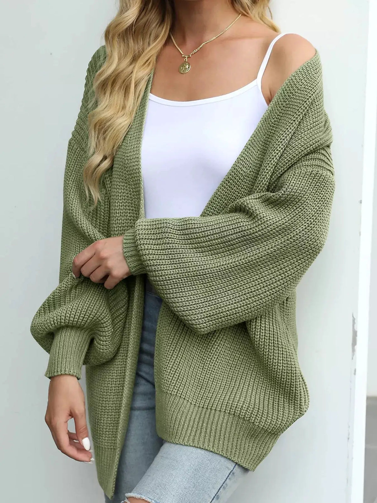 Cozy oversized chunky knit cardigan with lantern sleeves in olive green, open front by Trendsi.