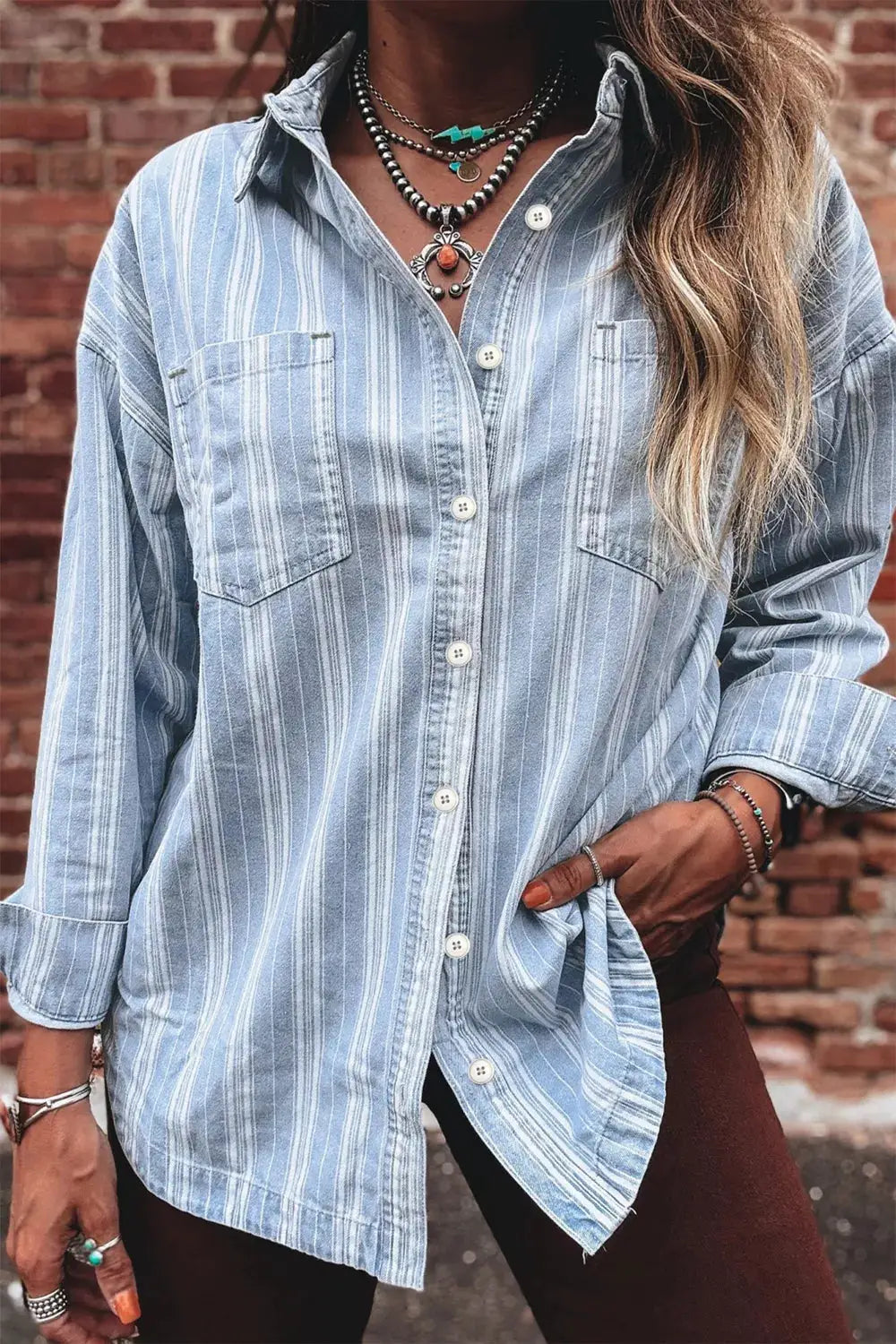 Striped boyfriend denim shacket with chest pockets, button front, and raw hem in light blue