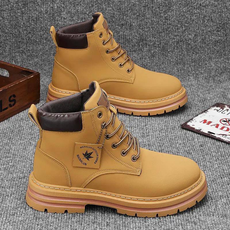 Winter Trendy Workwear Boots for Teens by AdTec, tan with black padded collar and chunky lug soles (2 boots).