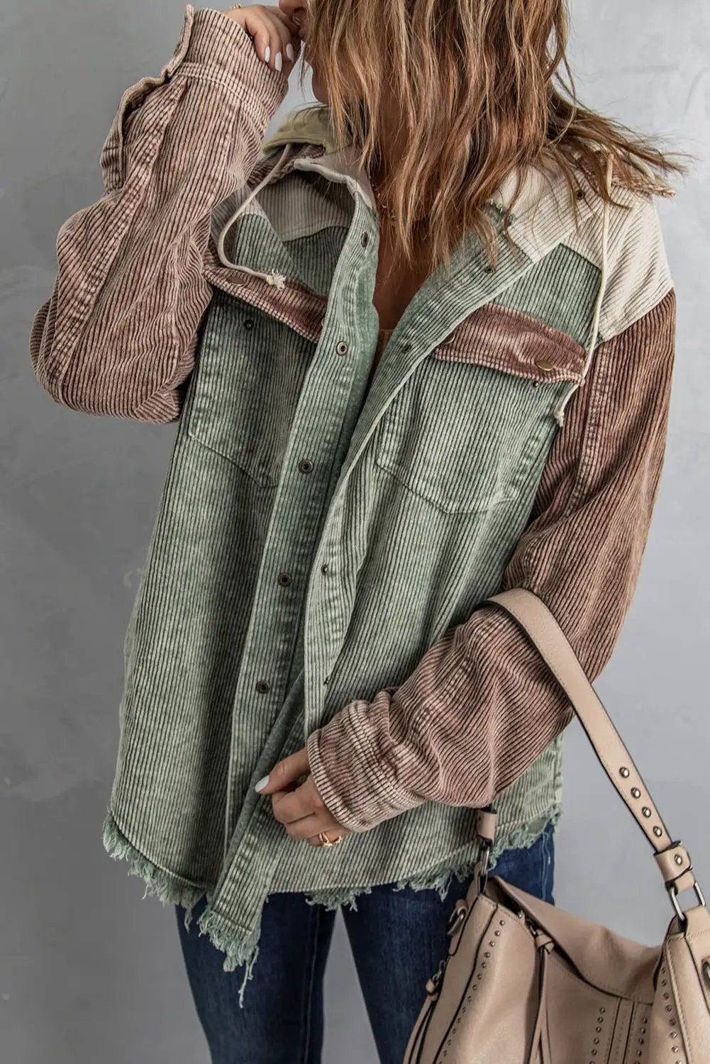 Snap Front Hooded Corduroy Shacket in green with brown striped sleeves, drawstring hood, chest pockets, frayed hem