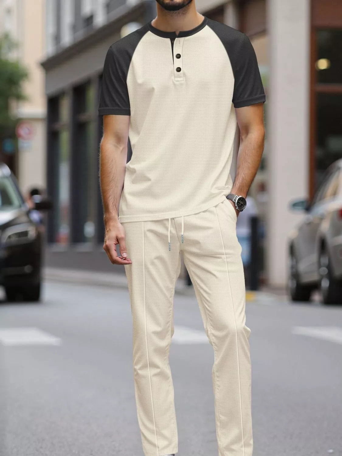 Men's plus-size two-tone raglan tee and pants set, cream with black sleeves, drawstring pants.
