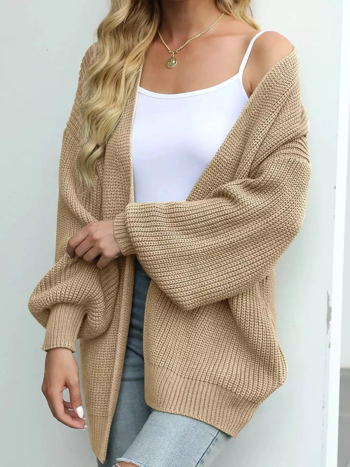 Oversized beige chunky knit cardigan with open front and stretch fabric
