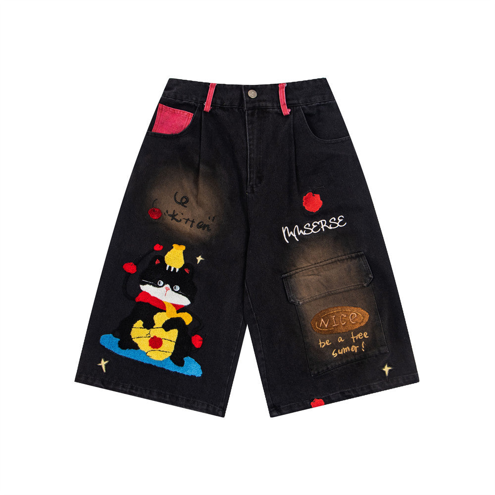 eprolo denim shorts with cartoon embroidery, black wash, red pocket trims and patchwork design