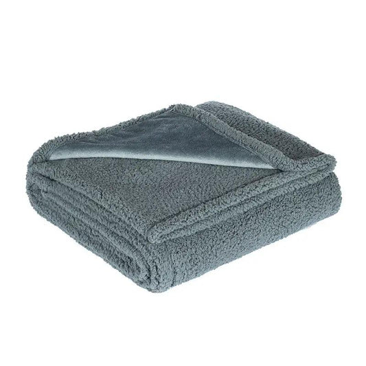 Waterproof blanket in blue-gray flannel cotton velvet, folded for storage