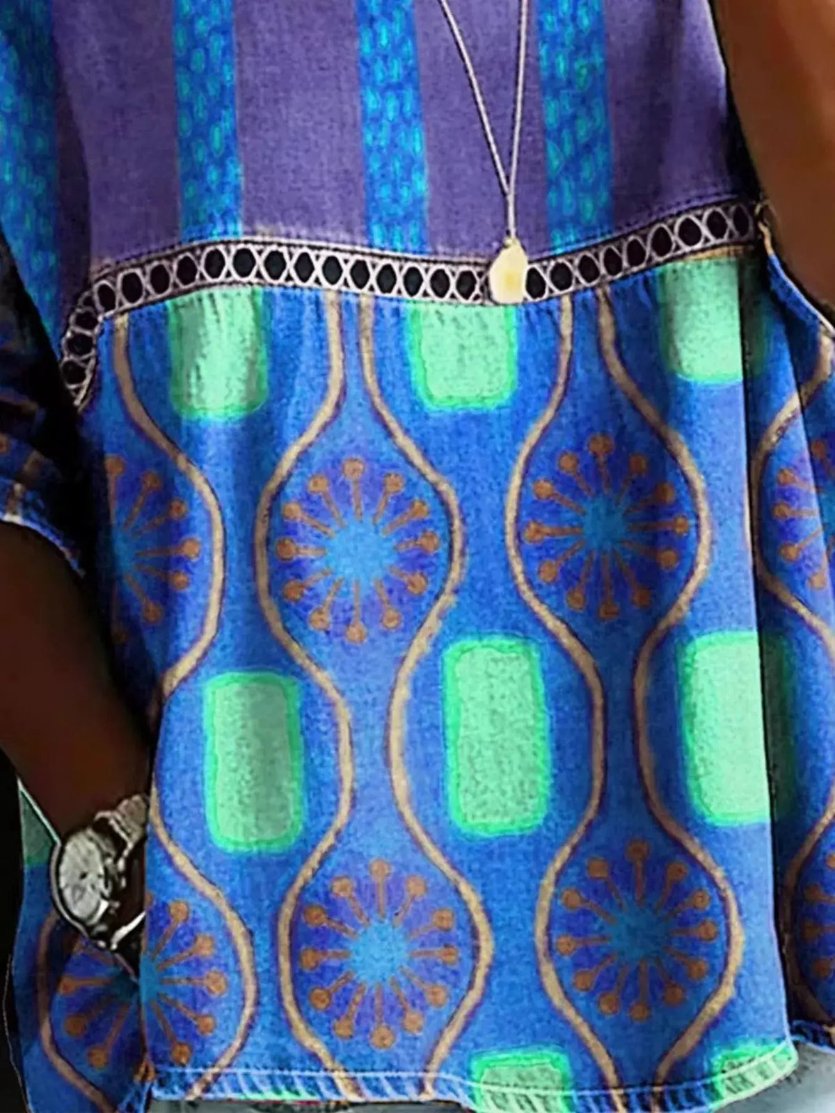Full Size Hollow Out Round Neck Top Plus Size in vivid blue with teal geometric print and black lattice trim