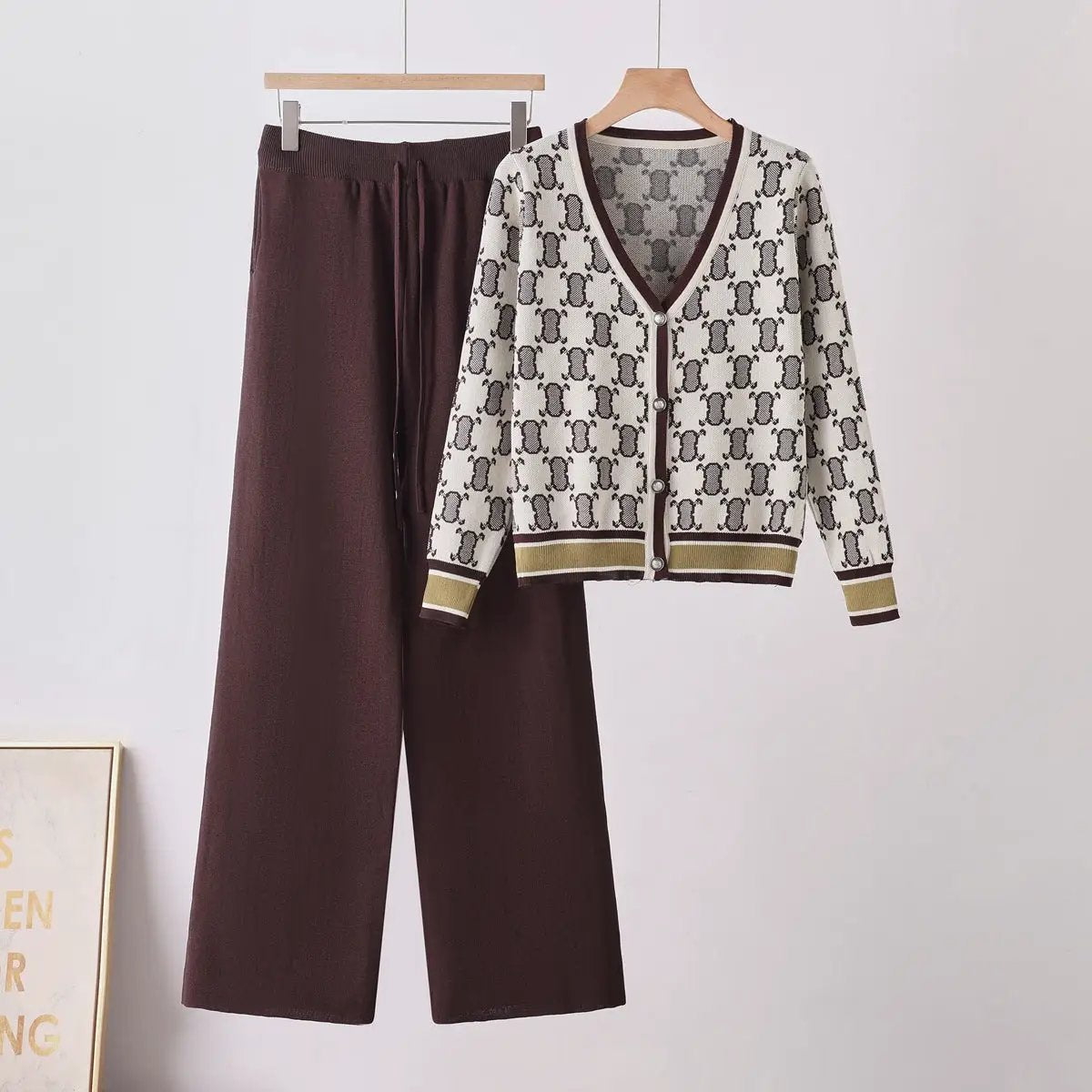 Chic women two-piece knit set: white cardigan with brown pattern and brown trim, paired with wide-leg brown pants