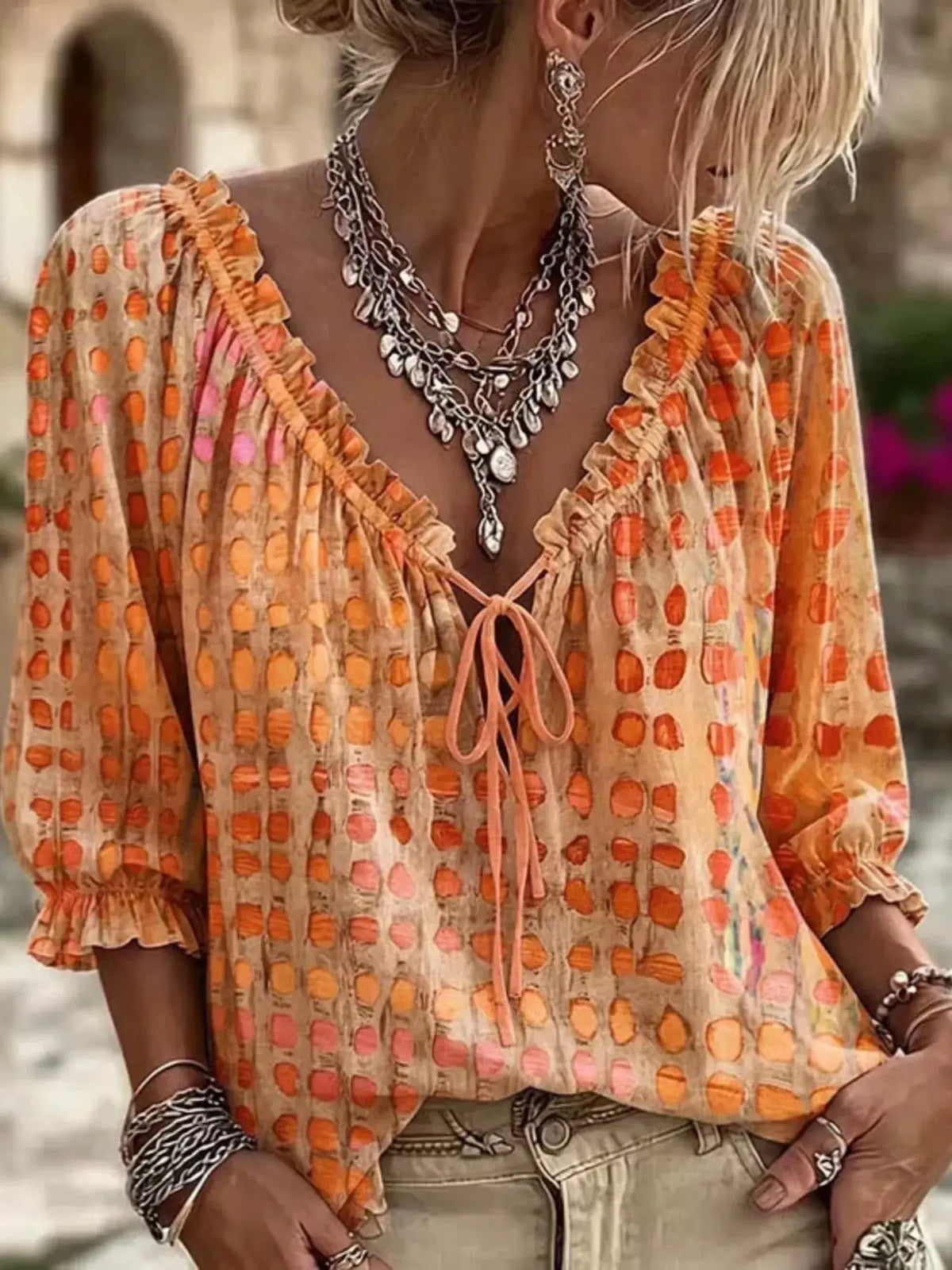 Tie-neck blouse, plus-size, 3/4 sleeves in orange printed sheer fabric with ruched cuffs