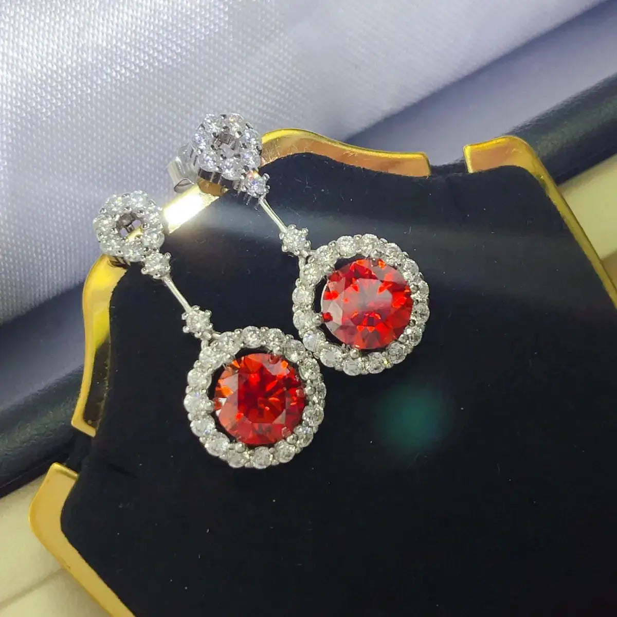 Pair of Trendsi ruby red crystal drop earrings with rhinestone halo
