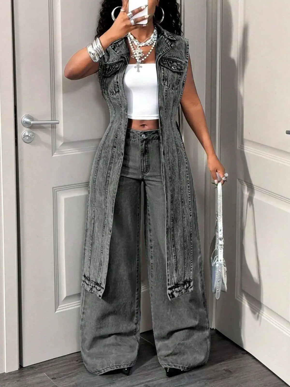 Open-front high-low denim vest in vintage gray wash with pockets by Trendsi