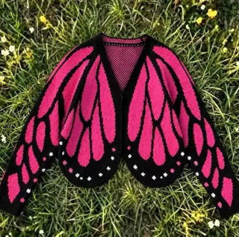 Women's butterfly knit cardigan sweater in pink and black with wing pattern, open front, long sleeves.
