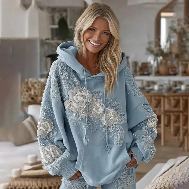 Womens Plus Size Relaxed Fit Pullover Hoodie Sweatshirt in light blue with white floral lace embroidery.