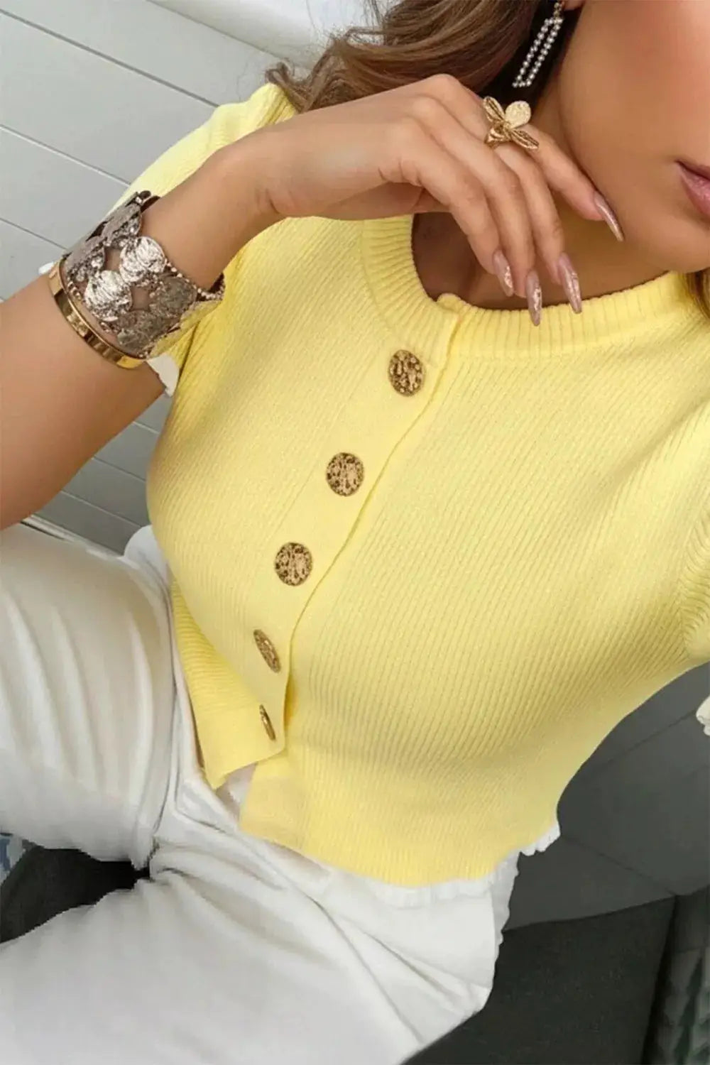 Short-sleeve ribbed knit cardigan in yellow with gold button closures