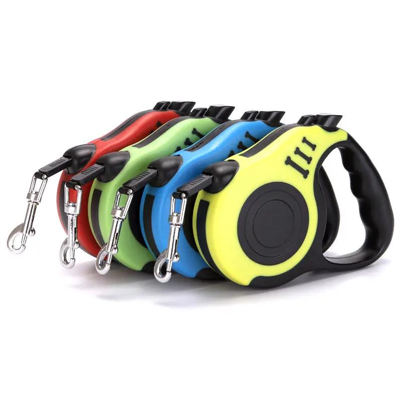 Pet automatic retractable leashes by AdTec; set of four in red, green, blue, yellow with metal clips.