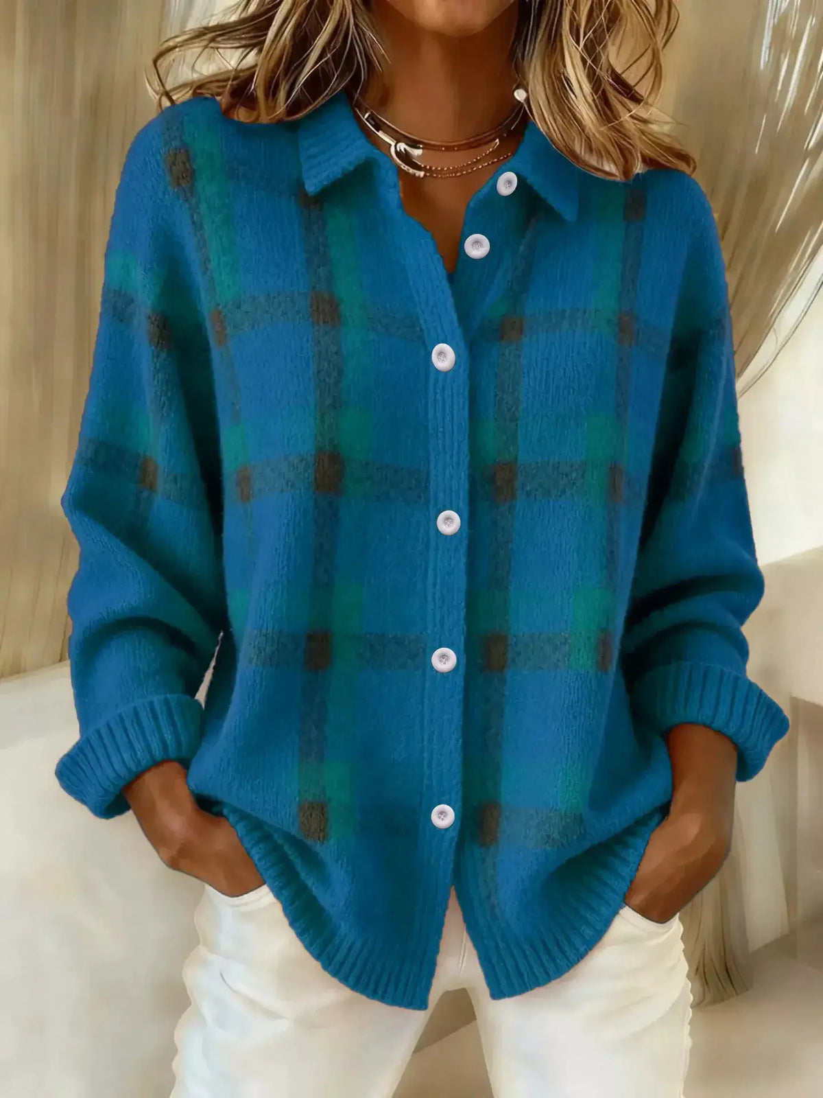 Stretchy plaid cardigan in teal-blue acrylic knit with a button-front and white buttons